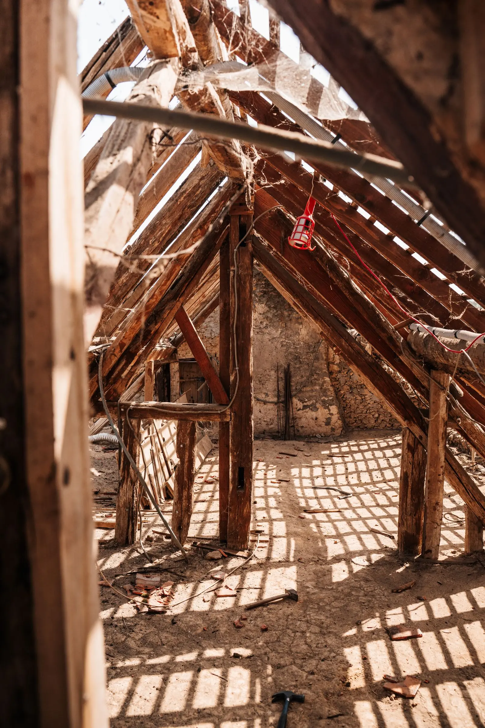 Exposed attic roof framing and timber beams being dried